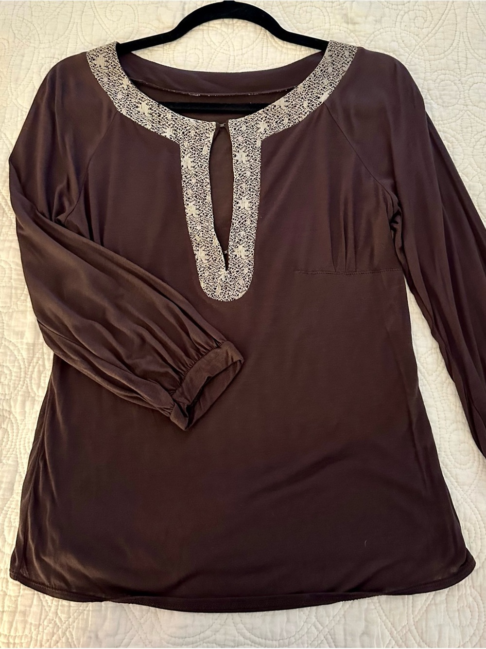 Knit top with metallic gold crochet trim